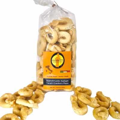 Transparent bag of Giannetti Artisans plain taralli crackers from Italy with a white background