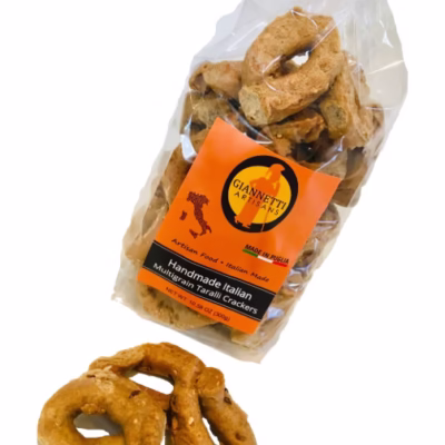 Front view of Giannetti Artisans handmade multigrain taralli bag with loose crackers displayed in front