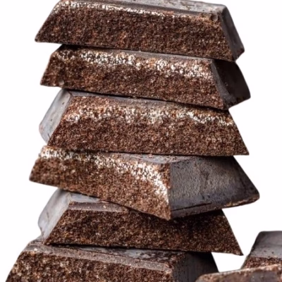 Stack of Modica chocolate pieces with white background for the Giannetti Artisans Artisan Chocolate & Cookies Collection
