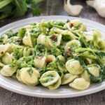 White plate showing Orecchiette pasta with Cime di Rapa