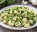 White plate showing Orecchiette pasta with Cime di Rapa