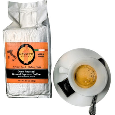 Giannetti Artisans product package of ground espresso coffee with espresso coffee and white cup prop
